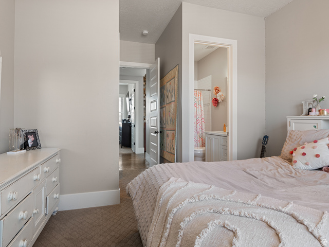 641 West 500 South Midway, UT 84049 - Photo 29 of 52 Neutral painted walls featuring a doorway leading to a full bathroom