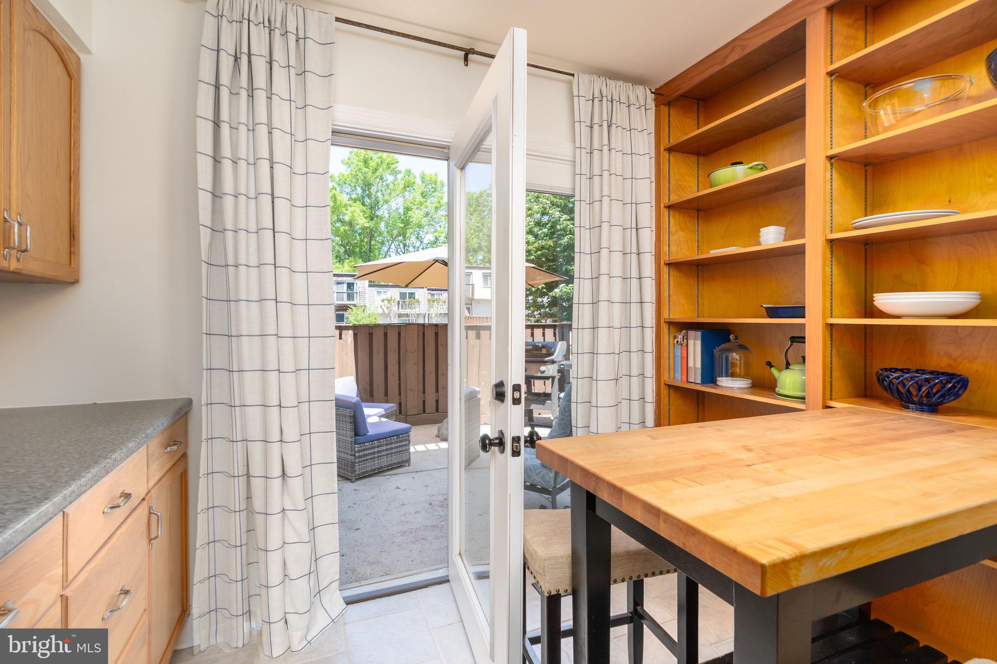 1656 Valencia Way Reston, VA 20190 - Photo 22 of 50 Door to the front patio from the kitchen
