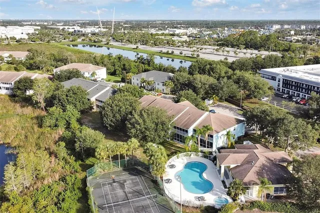 an aerial view of residential houses with outdoor space