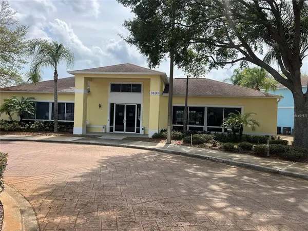 a front view of house with yard and outdoor seating