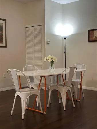 a view of a dining room with furniture and chandelier