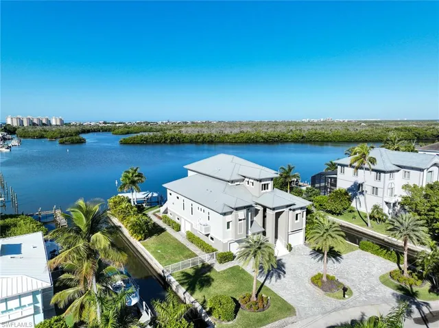 an aerial view of a house with a lake view