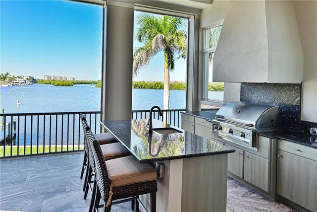 a kitchen with a table chairs stove and cabinets