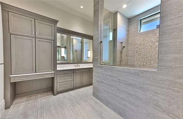 a room with a wooden floor and windows