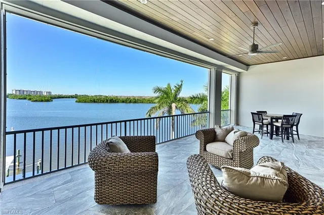 a balcony with couch and chairs