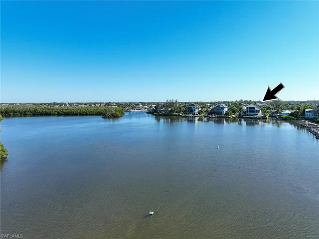 a view of a lake with houses in background