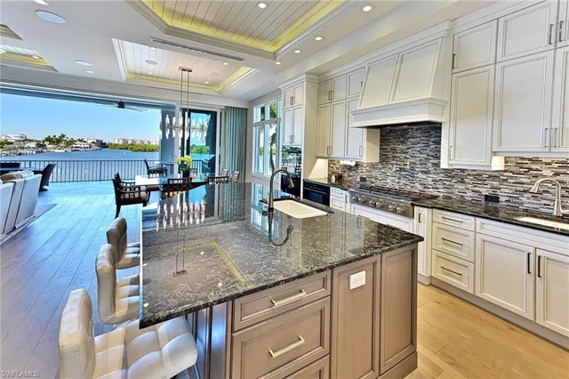 a kitchen with stainless steel appliances granite countertop a sink and a counter space
