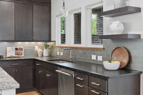 a kitchen with a sink and cabinets