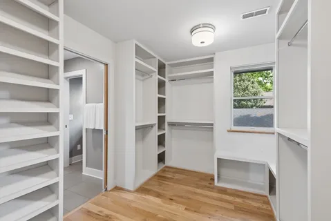 a view of bedroom with a bed and a window