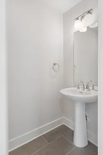 a bathroom with a sink and mirror