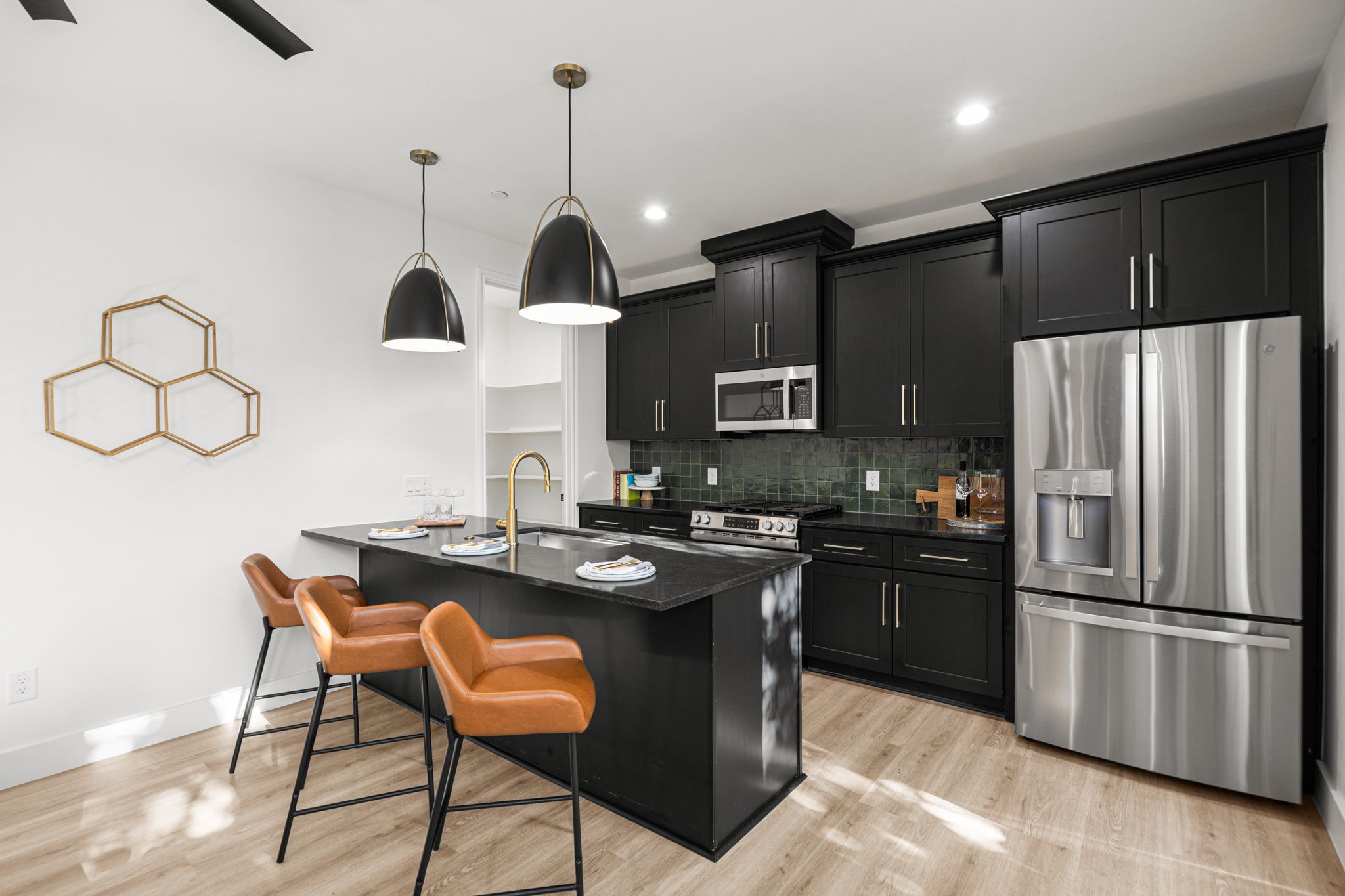 4611 Dewberry Street, Unit B Houston, TX 77021 - Photo 11 of 24 a kitchen with stainless steel appliances granite countertop a sink a stove and refrigerator