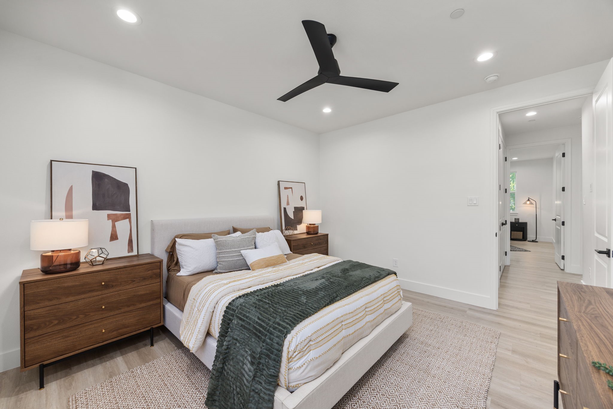 4611 Dewberry Street, Unit B Houston, TX 77021 - Photo 13 of 24 a bedroom with a bed and a chandelier