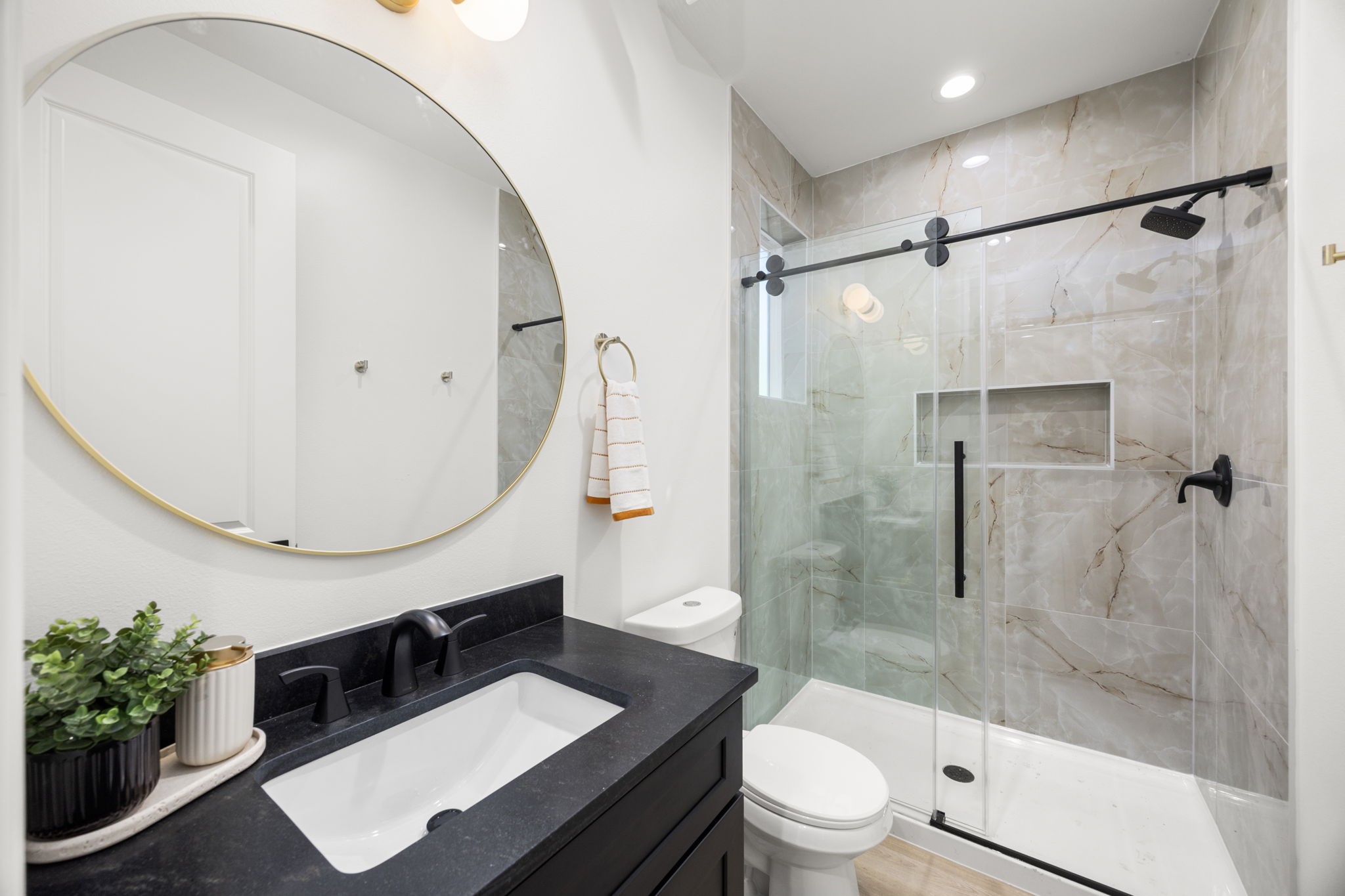 4611 Dewberry Street, Unit B Houston, TX 77021 - Photo 14 of 24 a bathroom with a sink a toilet and a mirror