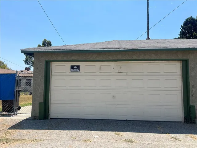 a view of a wooden door and a window
