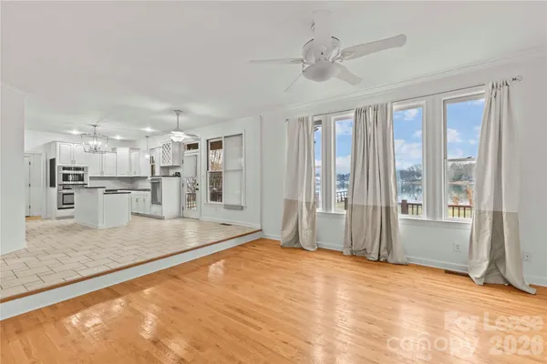 a view of a kitchen with a stove and cabinets