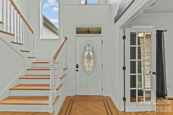 a view of front door with stairs
