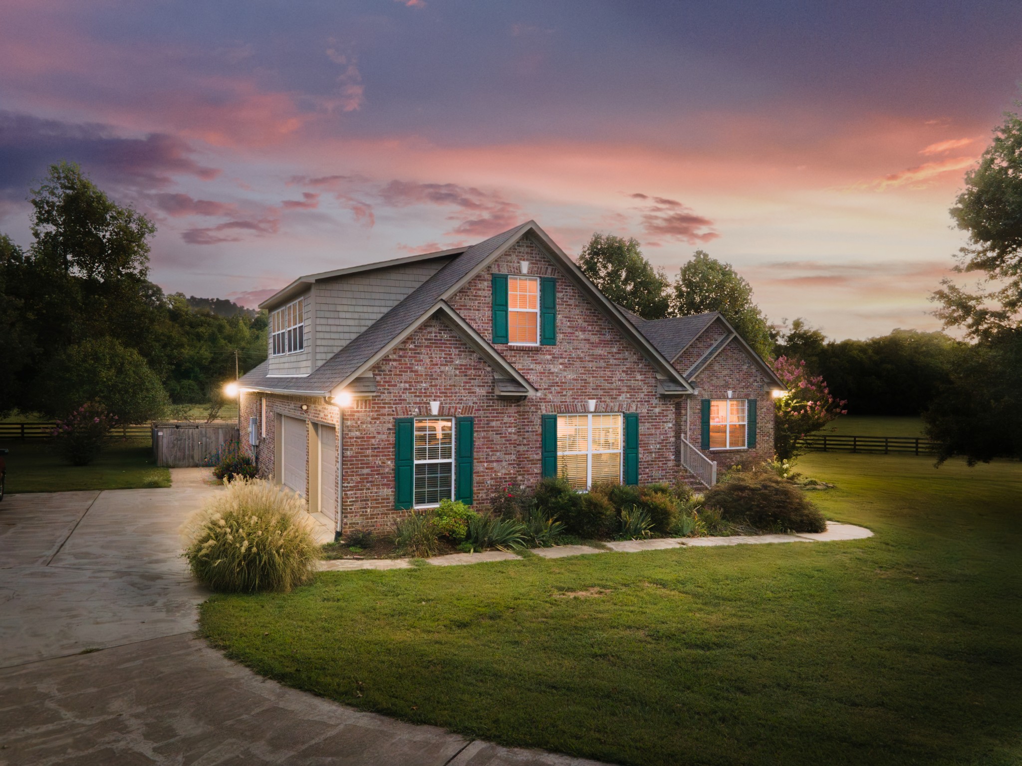 a front view of a house with garden
