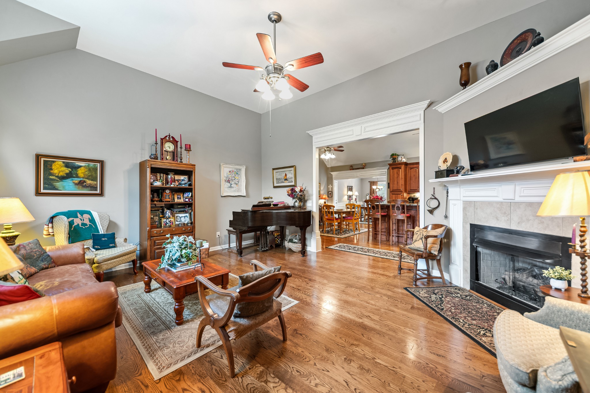 4862 Toll Dugger Road Culleoka, TN 38451 - Photo 17 of 96 a living room with furniture a flat screen tv and a fireplace