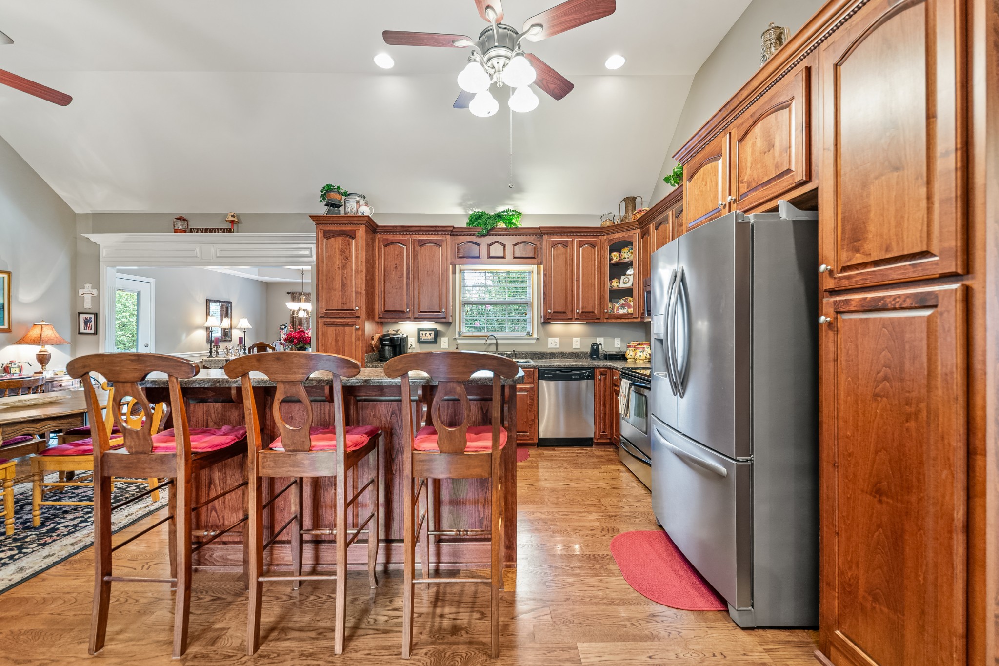 4862 Toll Dugger Road Culleoka, TN 38451 - Photo 22 of 96 a kitchen with stainless steel appliances a refrigerator a sink dishwasher a oven with a dining table and chairs