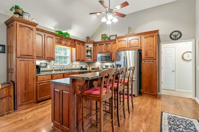 a bathroom with a sink a mirror and a shower