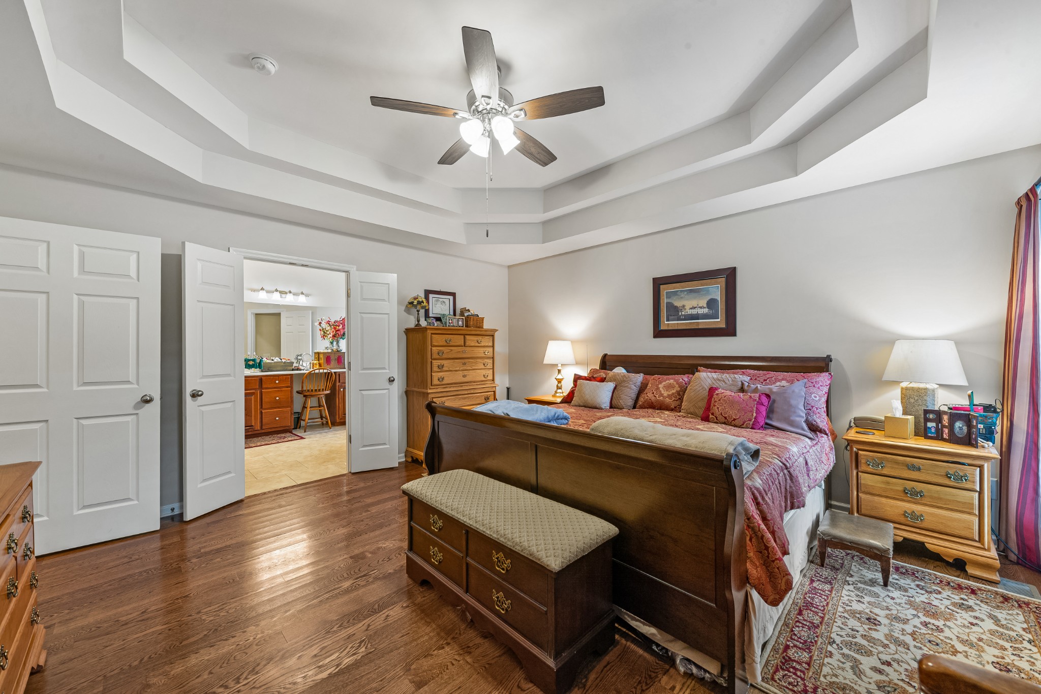 4862 Toll Dugger Road Culleoka, TN 38451 - Photo 37 of 96 a bedroom with a bed and a chandelier