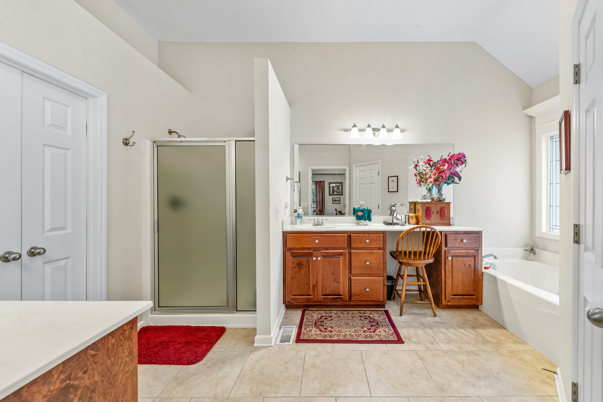 4862 Toll Dugger Road Culleoka, TN 38451 - Photo 40 of 96 a spacious bathroom with a tub sink mirror and a shower