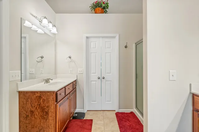 an aerial view of a house with a yard and lake view