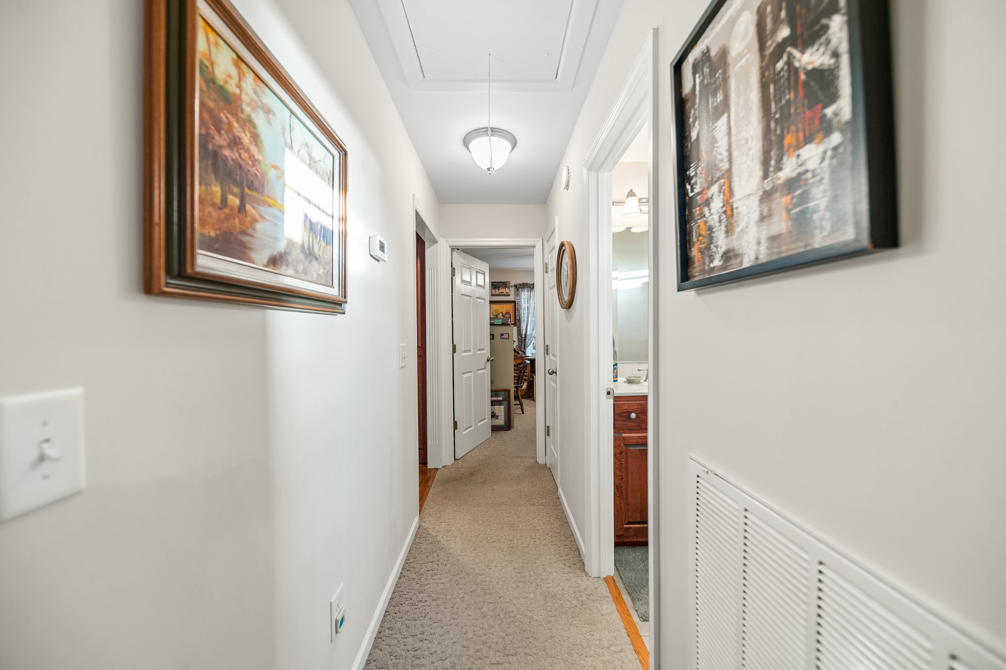 4862 Toll Dugger Road Culleoka, TN 38451 - Photo 50 of 96 a view of a hallway with paintings on the wall