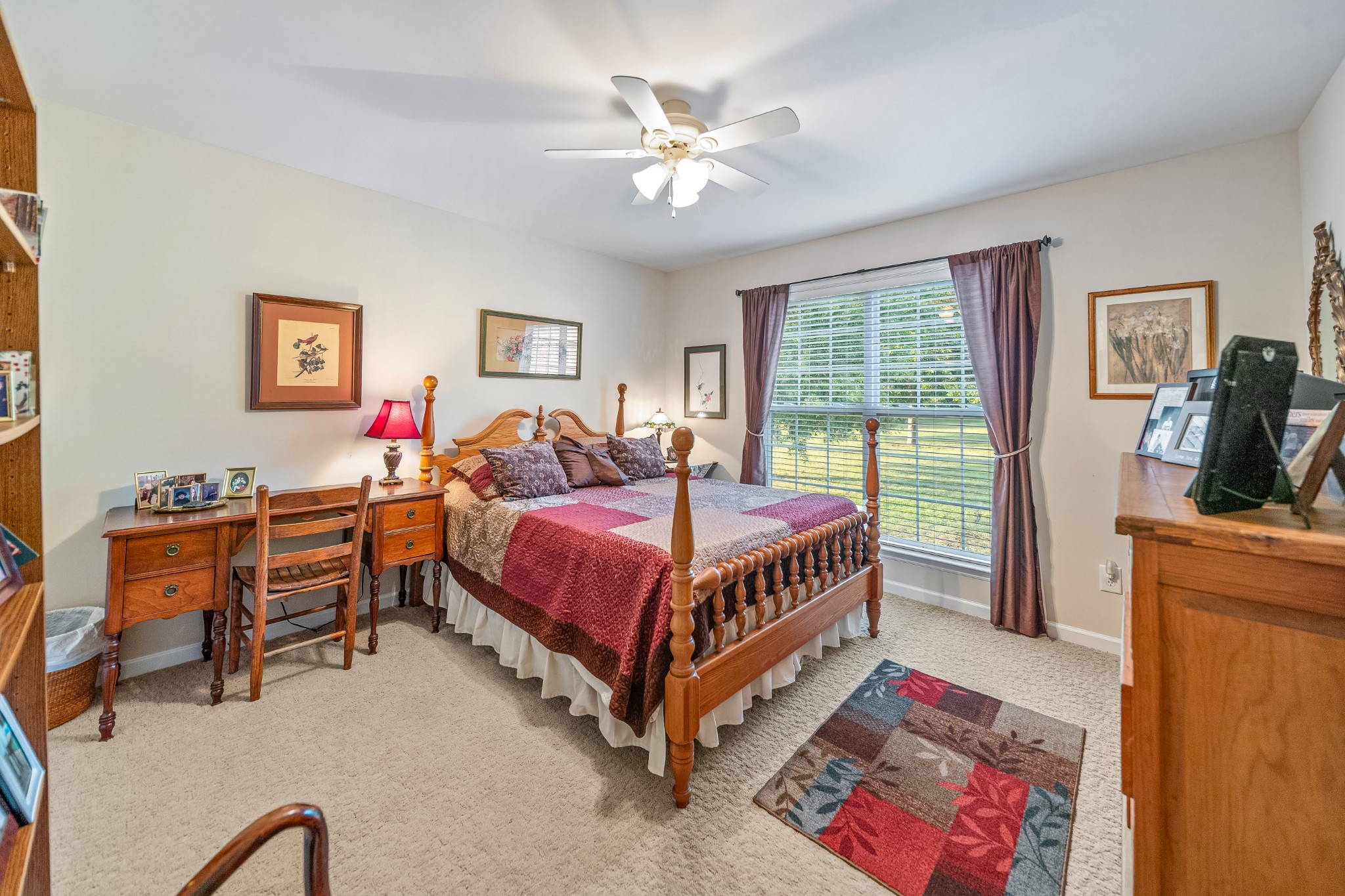 4862 Toll Dugger Road Culleoka, TN 38451 - Photo 51 of 96 a bed room with a bed and a chandelier