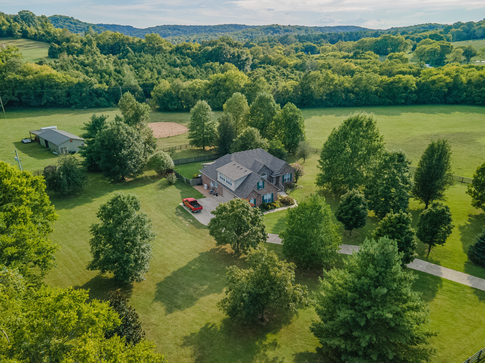 4862 Toll Dugger Road Culleoka, TN 38451 - Photo 68 of 96 an aerial view of green landscape with trees houses and lake view