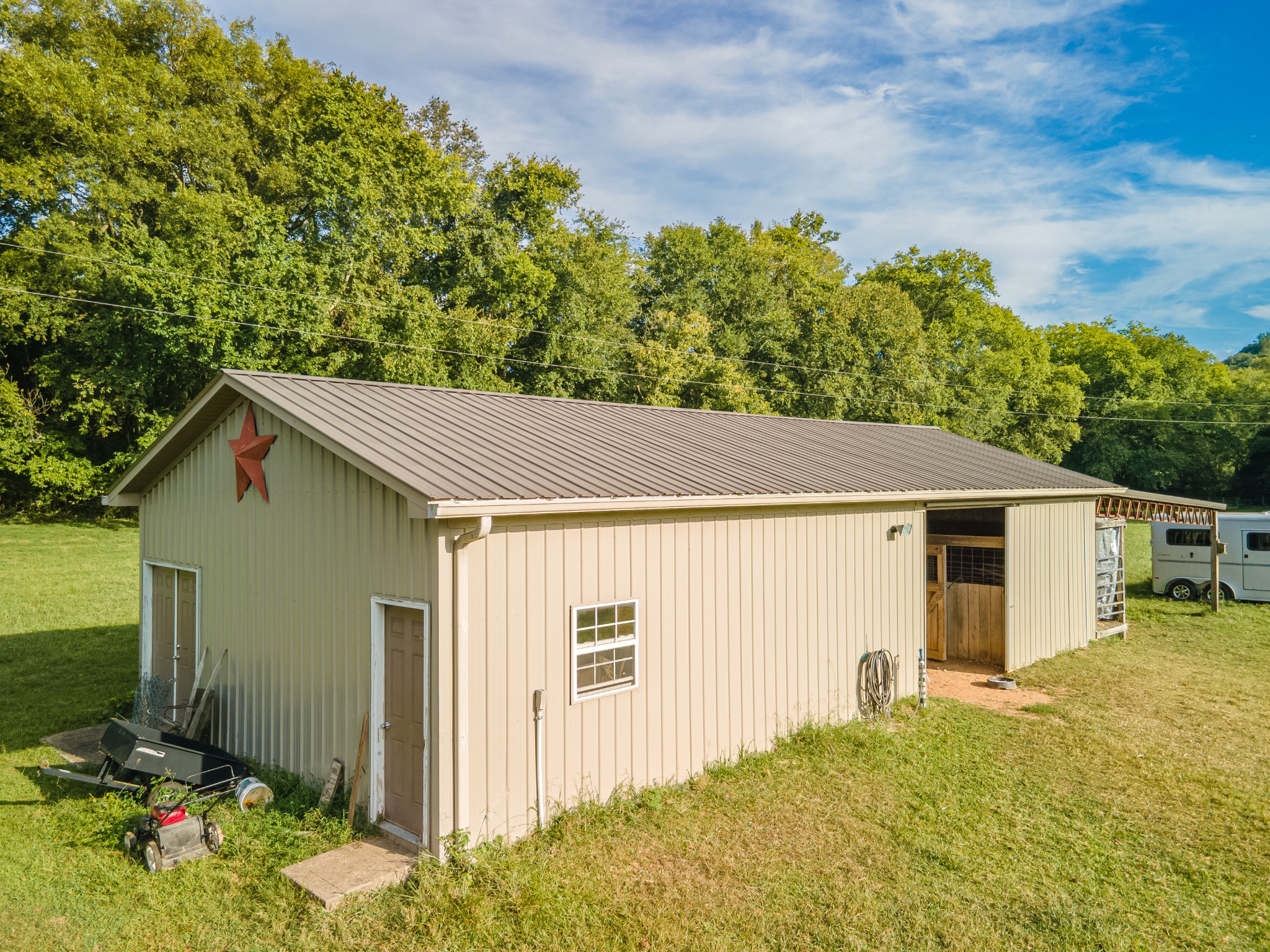 4862 Toll Dugger Road Culleoka, TN 38451 - Photo 90 of 96 a backyard of a house with plants and trees with wooden fence