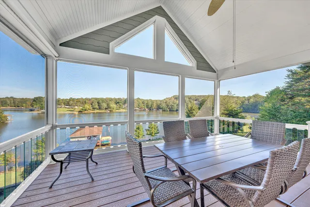 a living room with a bed furniture and a window