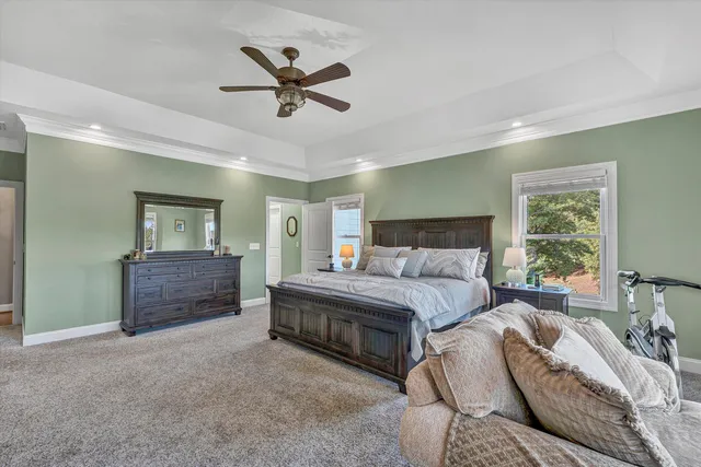 a bathroom with a tub a sink and a mirror