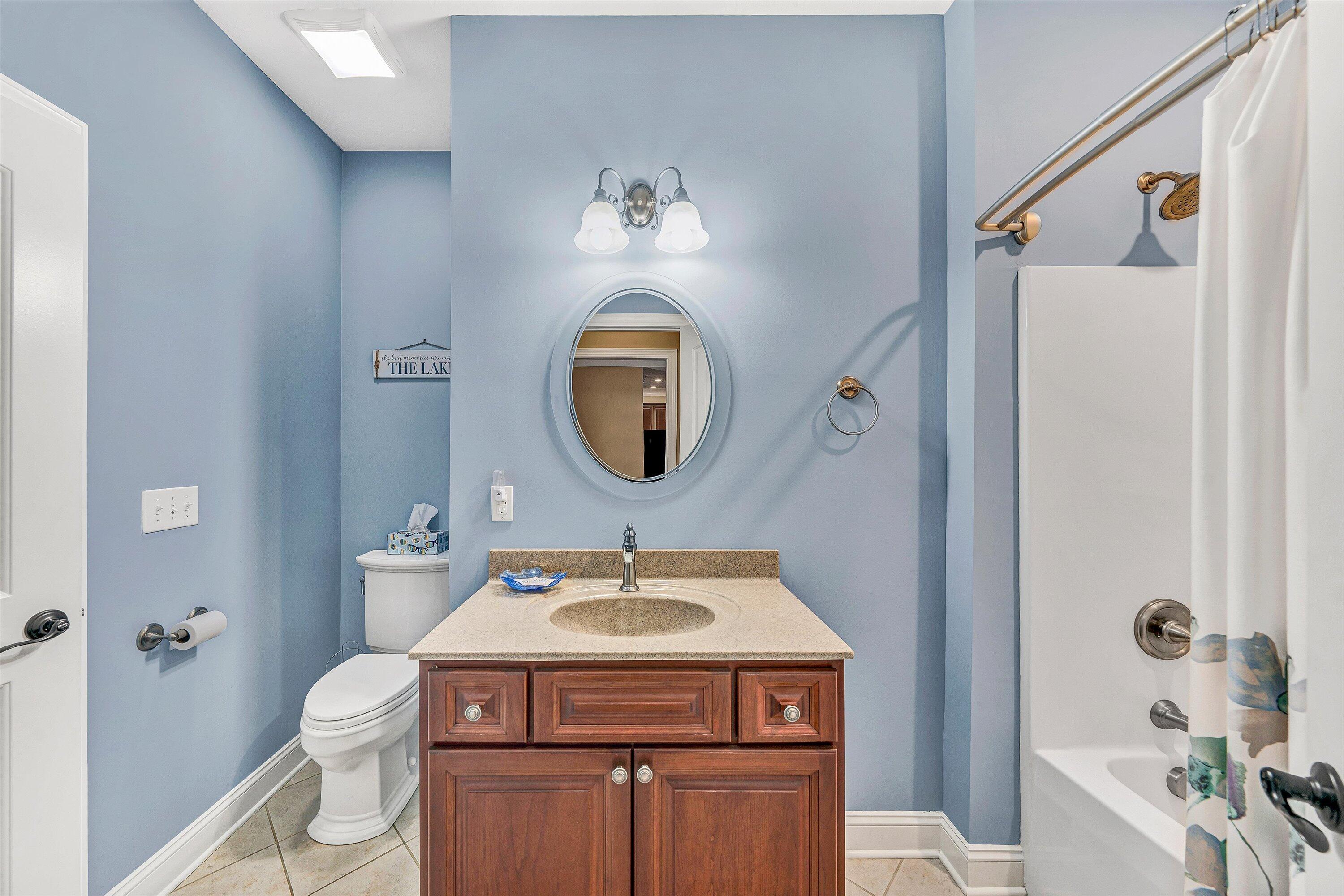 440 Augusta Way Wirtz, VA 24184 - Photo 27 of 63 a bathroom with a toilet a sink and a mirror