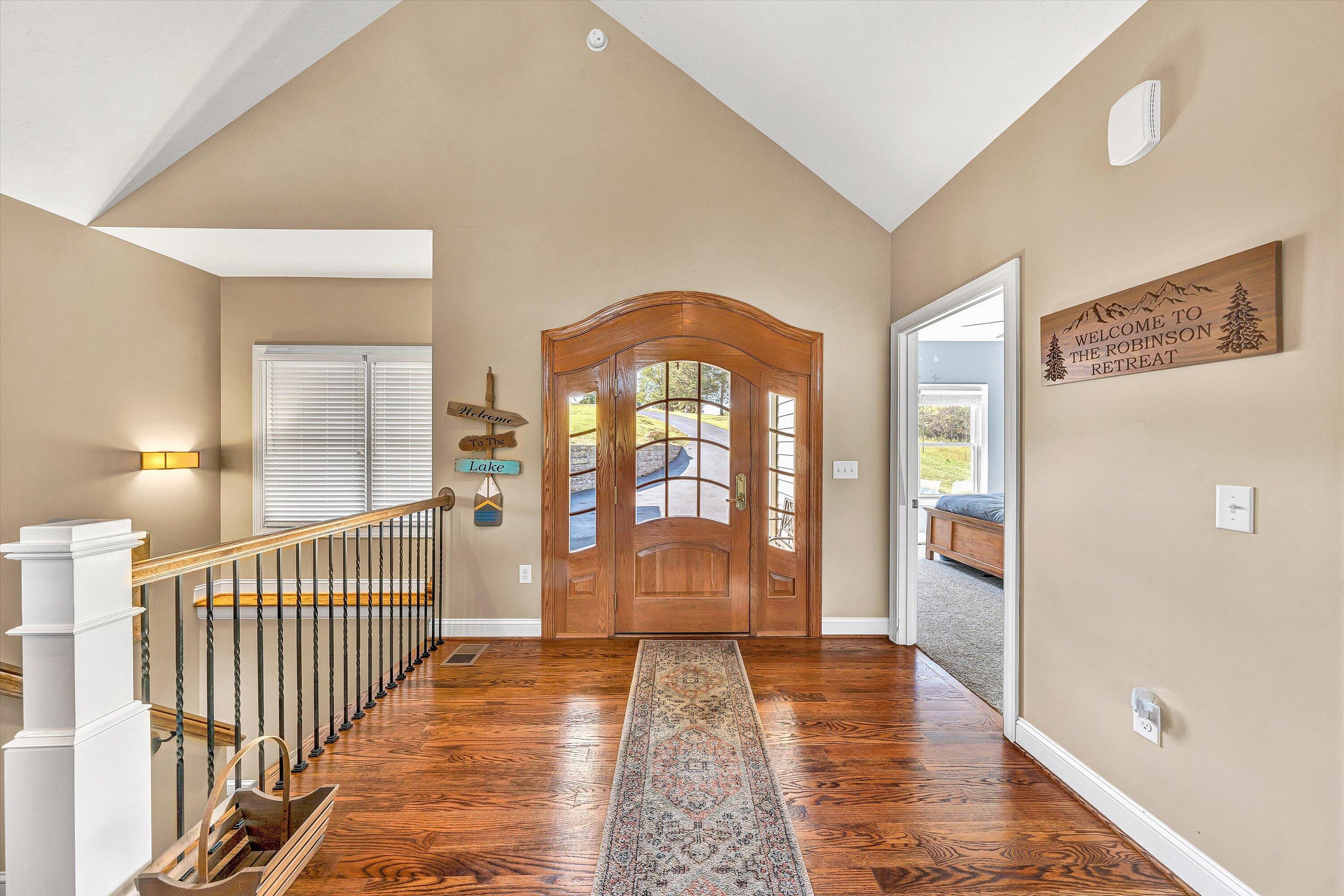 440 Augusta Way Wirtz, VA 24184 - Photo 4 of 63 a view of a hallway with wooden floor and windows