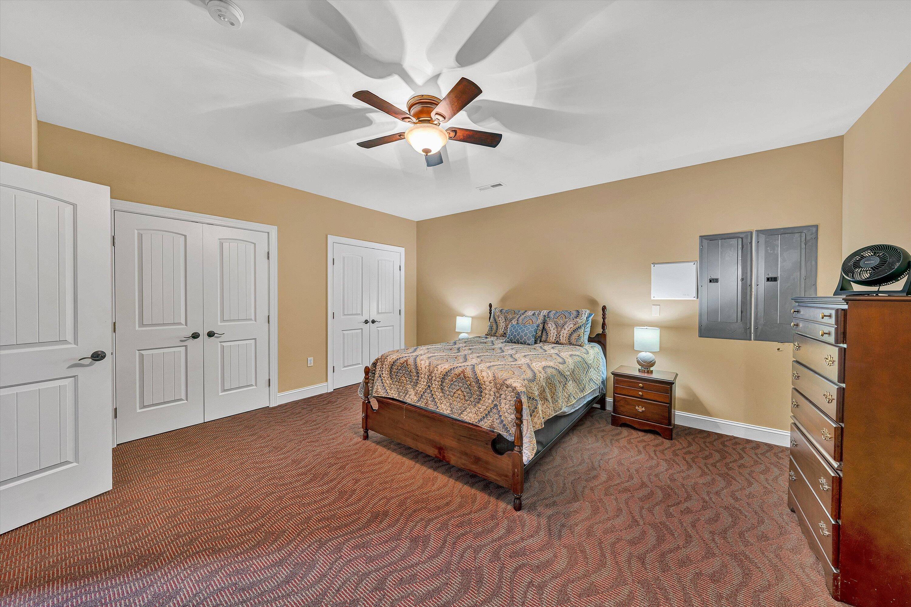 440 Augusta Way Wirtz, VA 24184 - Photo 42 of 63 a spacious bedroom with a bed and a chandelier