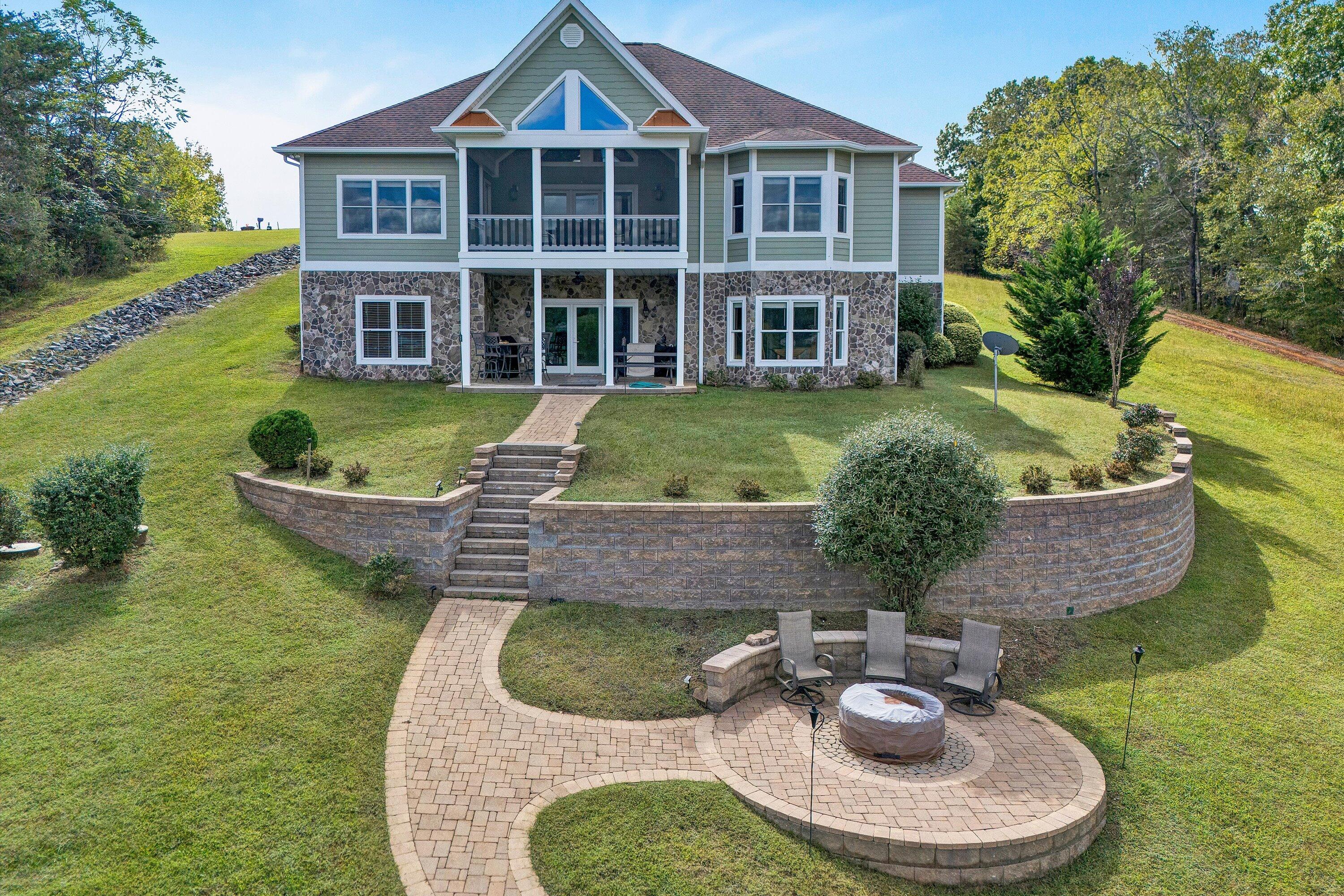 440 Augusta Way Wirtz, VA 24184 - Photo 57 of 63 a aerial view of a house with swimming pool and garden