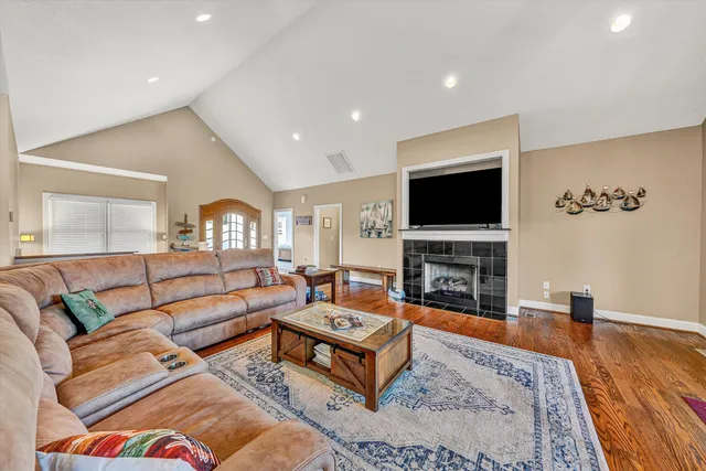 a kitchen with stainless steel appliances granite countertop wooden cabinets counter space and a window