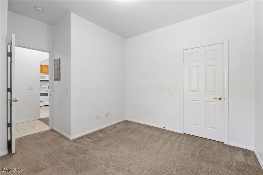 1430 Star Road Pahrump, NV 89048 - Photo 20 of 32 Spare room with carpet, electric panel, and a smoke detector