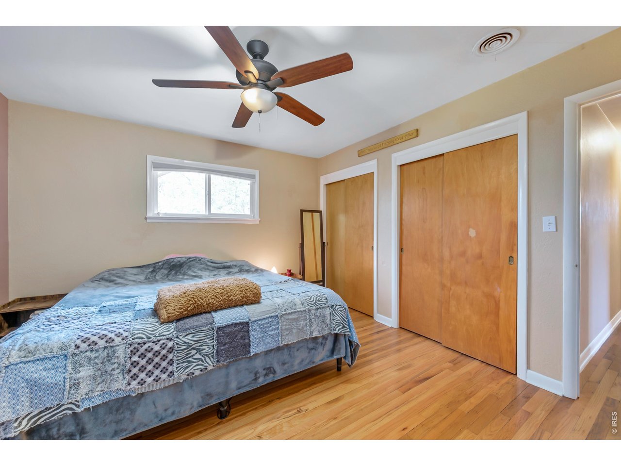 1709 Dale Court Fort Collins, CO 80521 - Photo 18 of 26 a bedroom with a bed and a large mirror