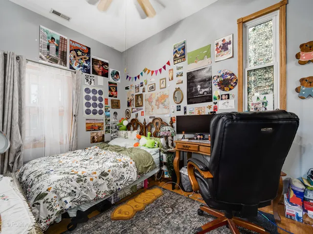 a bedroom with bed and a window