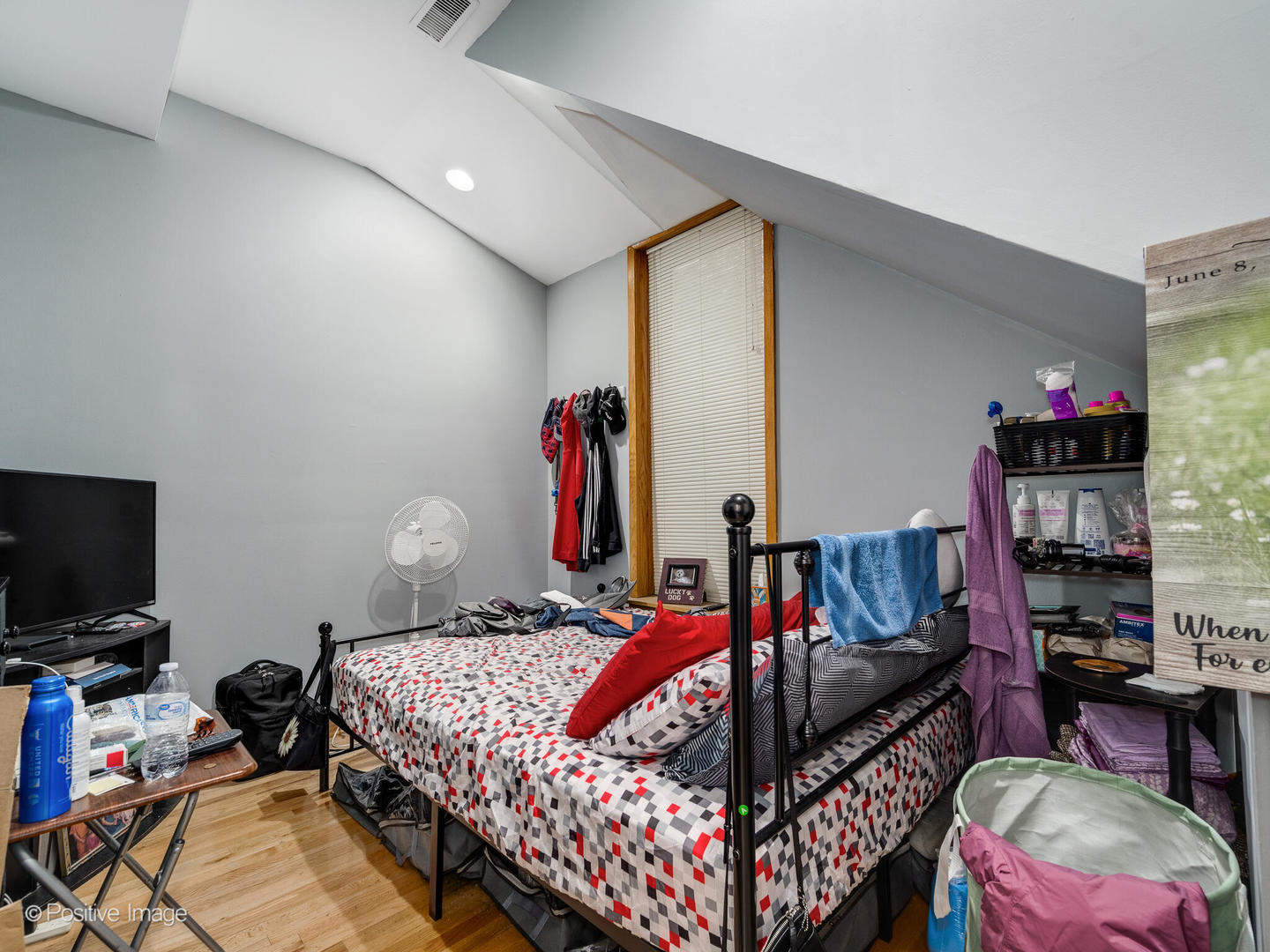 1517 West Taylor Street Chicago, IL 60607 - Photo 9 of 27 a bedroom with a bed and a flat screen tv