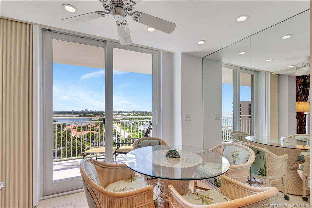 500 Ocean Drive, Unit W11 North Palm Beach, FL 33408 - Photo 12 of 77 a dining room with furniture a chandelier and wooden floor