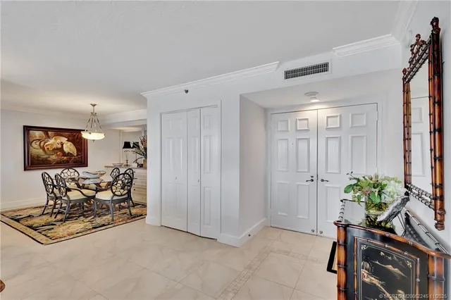 a living room with furniture gym equipment and a potted plant