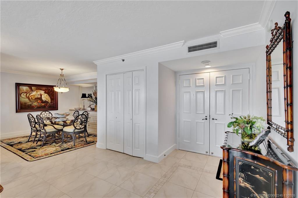 500 Ocean Drive, Unit W11 North Palm Beach, FL 33408 - Photo 2 of 77 a view of a livingroom with furniture and a potted plant