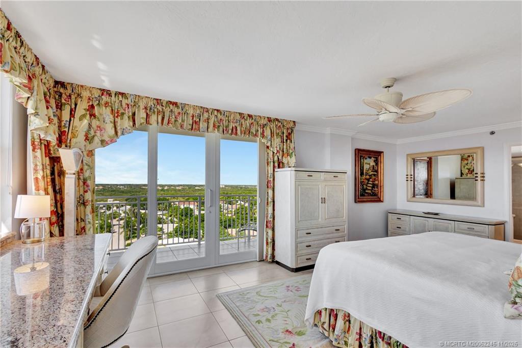 500 Ocean Drive, Unit W11 North Palm Beach, FL 33408 - Photo 28 of 77 a spacious bedroom with a large bed and a large window