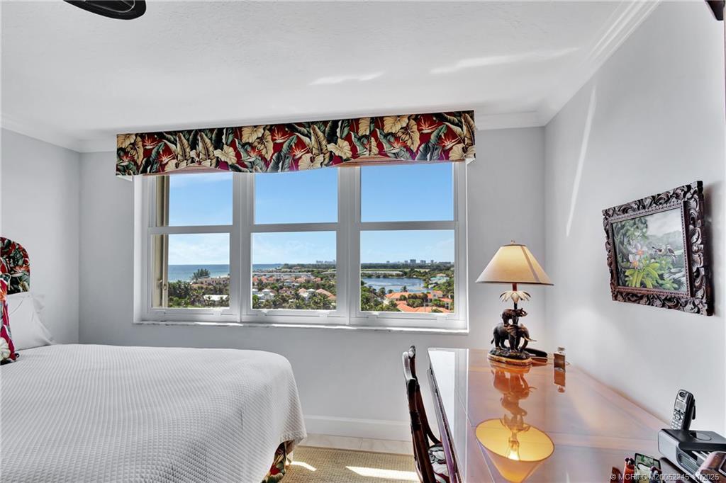 500 Ocean Drive, Unit W11 North Palm Beach, FL 33408 - Photo 31 of 77 a bed room with a bed and a chair