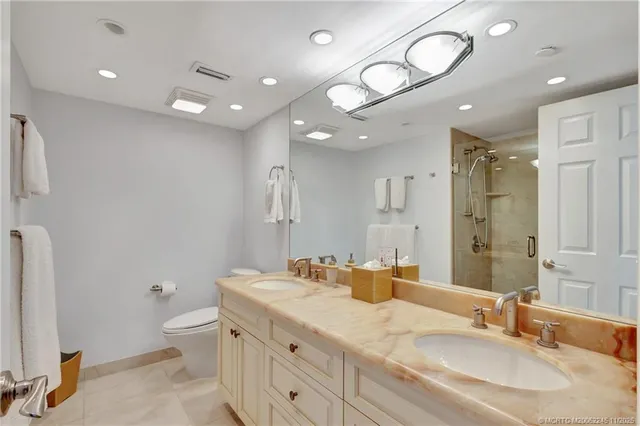 a view of swimming pool with a table and chairs under an umbrella