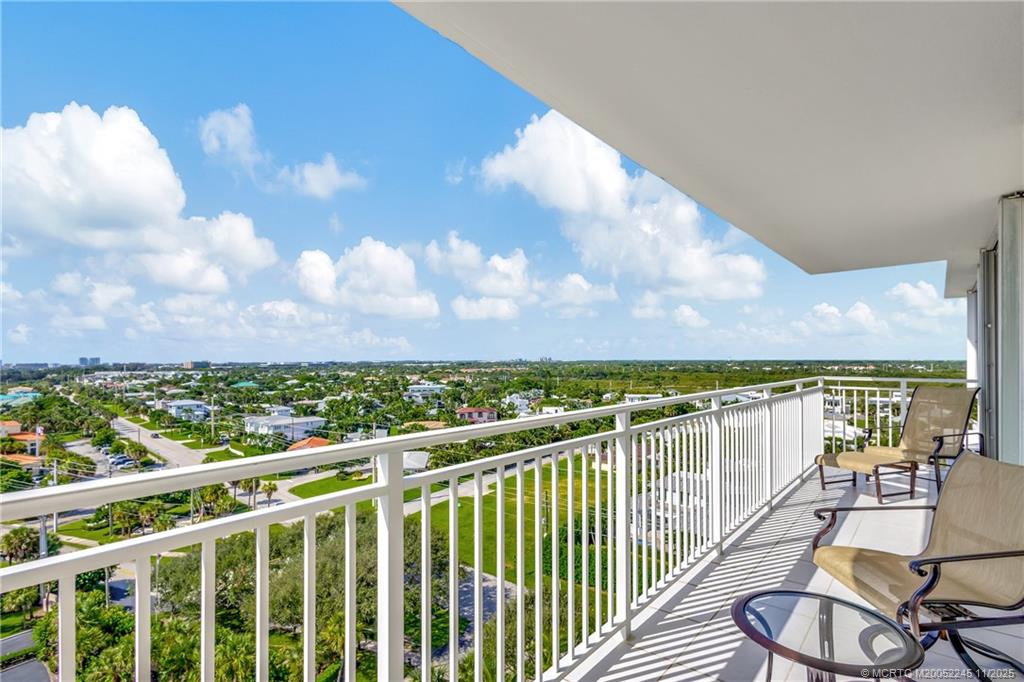 500 Ocean Drive, Unit W11 North Palm Beach, FL 33408 - Photo 38 of 77 a view of a balcony with wooden floor & fence