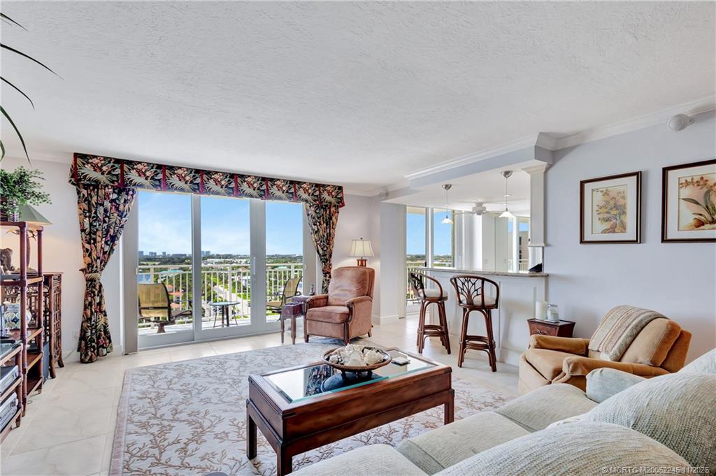 500 Ocean Drive, Unit W11 North Palm Beach, FL 33408 - Photo 4 of 77 a living room with furniture and a floor to ceiling window